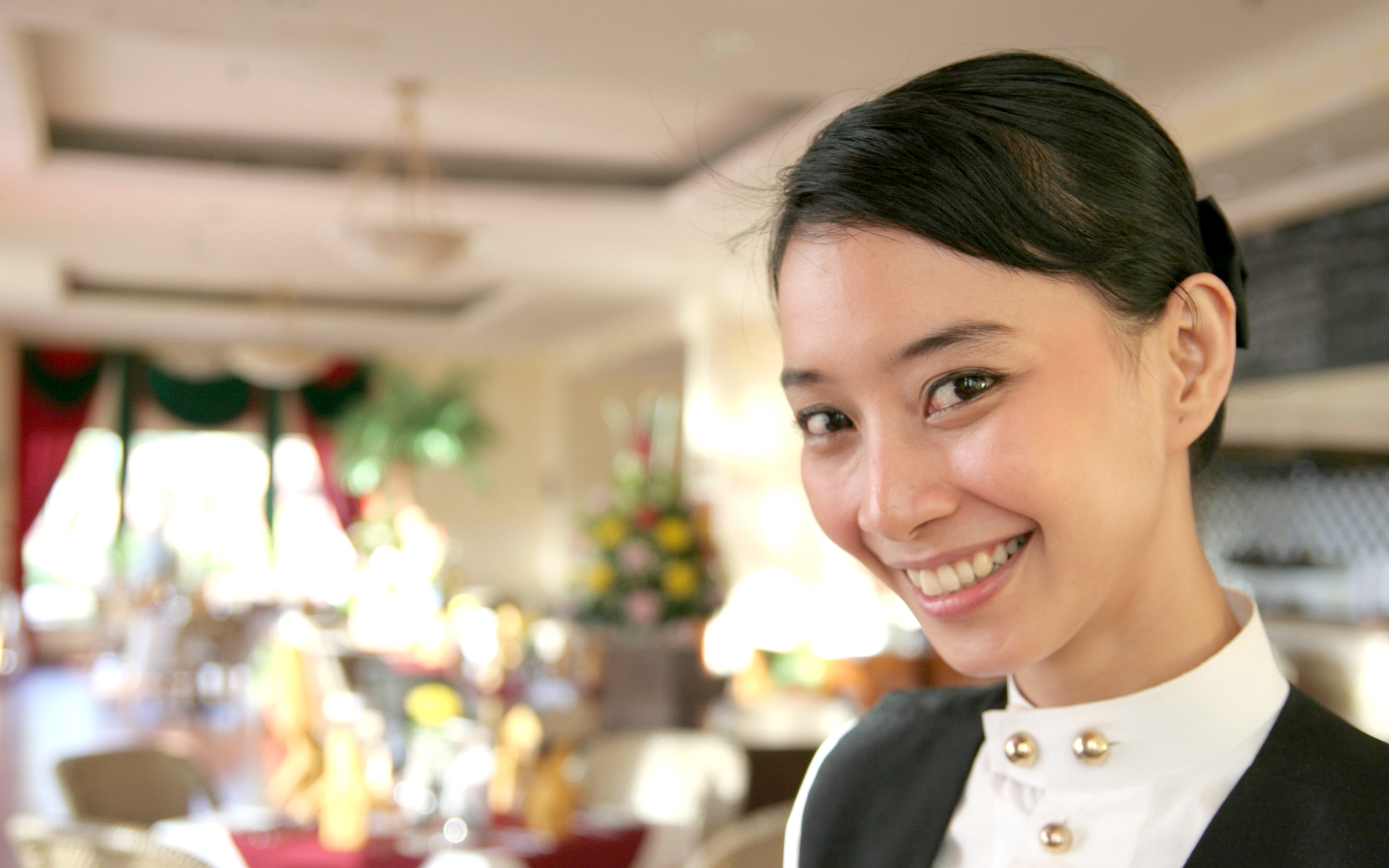 Hotel attendant smiling